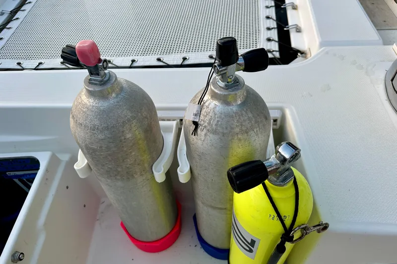 Slide: The Image of Scuba tanks on a 2016 Lagoon 450 S catamaran deck, ready for diving adventure. - 34