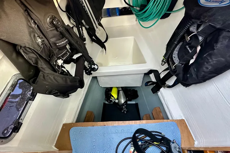 Slide: The Image of Scuba gear storage area on a 2016 Lagoon 450 S catamaran. - 35