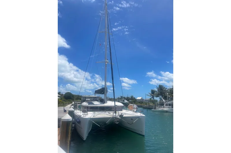 Slide: The Image of Sailing on a 2016 Lagoon 450 S catamaran with vibrant blue and white sails. - 39