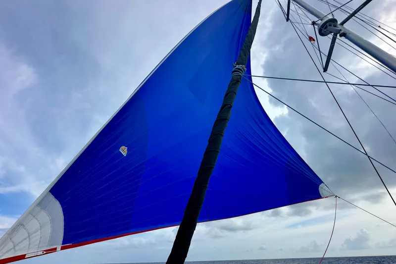 Slide: The Image of Blue sail on a 2016 Lagoon 450 S catamaran against cloudy sky. - 40
