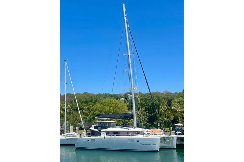 Slide: The Image of Lagoon 450 S catamaran interior with view of large cargo ship on the water. - 45