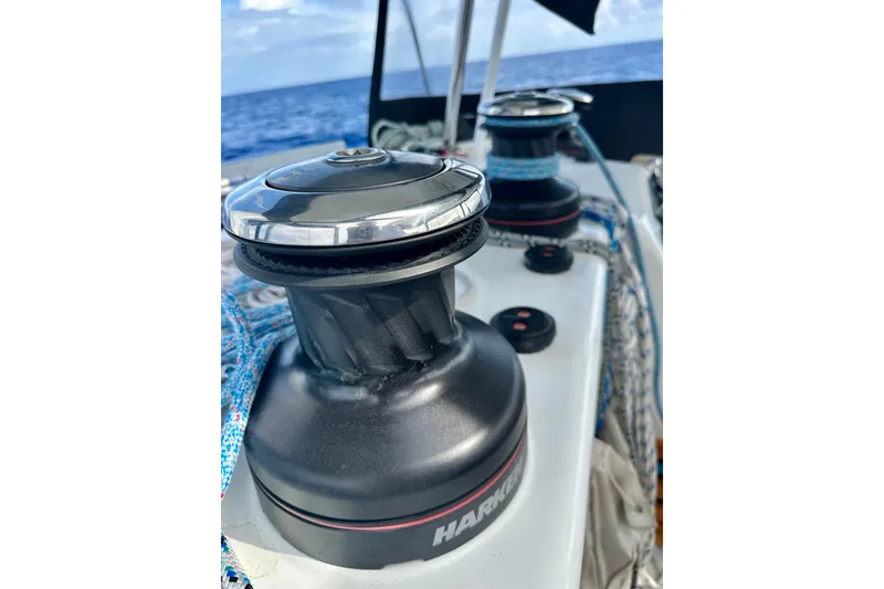 Slide: The Image of Close-up of winches on a 2016 Lagoon 450 S catamaran, with ocean in background. - 46
