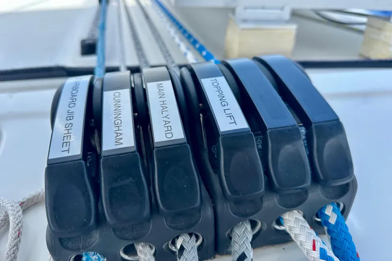 Slide: The Image of Close-up of labeled rope clutches on a 2016 Lagoon 450 S sailboat. - 49