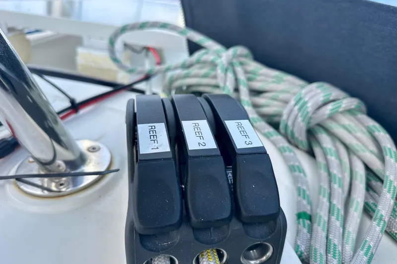 Slide: The Image of Close-up of reefing lines and winch on a 2016 Lagoon 450 S sailboat. - 52