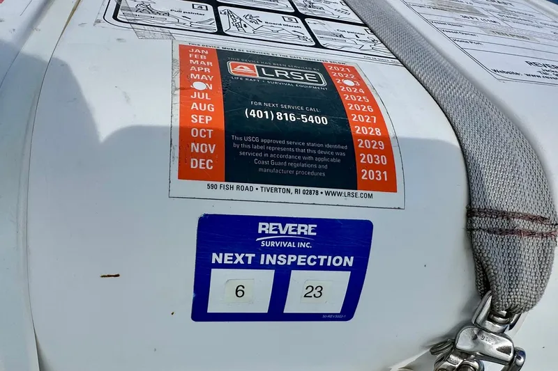 Slide: The Image of Life raft inspection labels on Lagoon 450 S, 2016 model, showing service dates and contact information. - 53