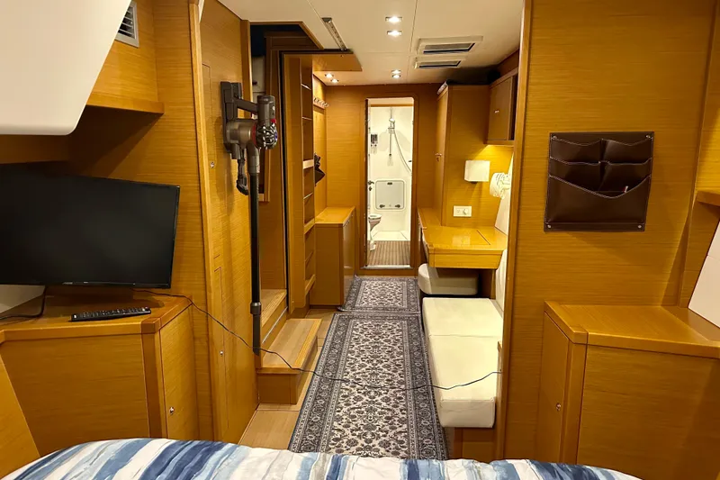 Slide: The Image of Interior of 2016 Lagoon 450 S yacht with modern wood finish and cozy seating area. - 61