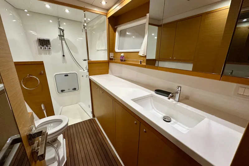 Slide: The Image of Luxurious bathroom in 2016 Lagoon 450 S yacht with modern fixtures and wooden accents. - 65
