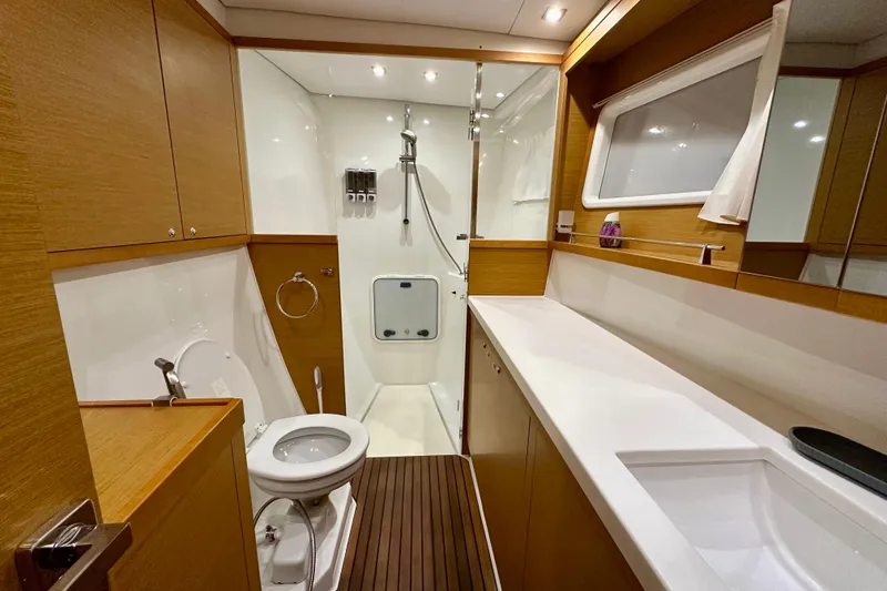Slide: The Image of Luxurious bathroom in 2016 Lagoon 450 S yacht, featuring modern fixtures and wooden accents. - 66