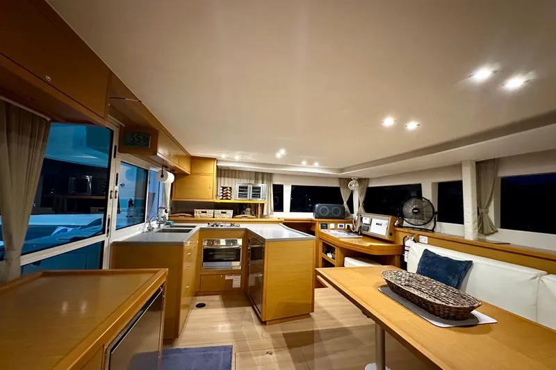 Slide: The Image of Interior of 2016 Lagoon 450 S yacht with modern kitchen and seating area. - 70