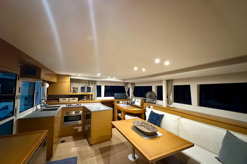 Slide: The Image of Interior of 2016 Lagoon 450 S yacht with modern kitchen and dining area. - 71