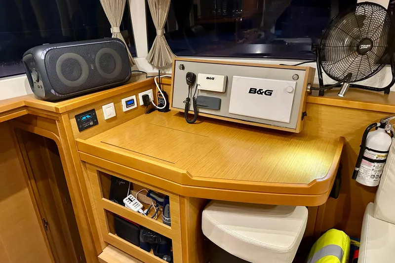 Slide: The Image of Navigation station on 2016 Lagoon 450 S catamaran with B&G equipment and safety gear. - 74
