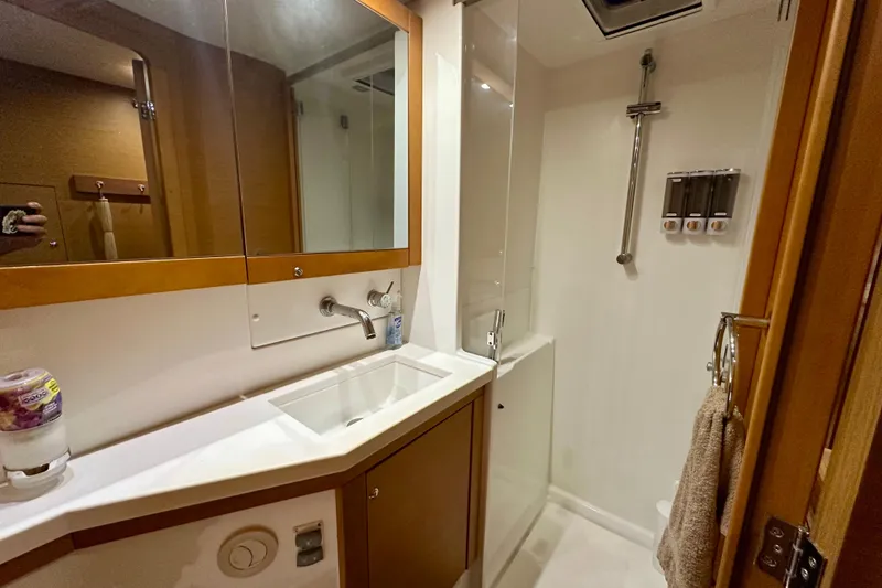 Slide: The Image of Modern bathroom interior on a 2016 Lagoon 450 S yacht, featuring sleek fixtures and ample storage. - 81