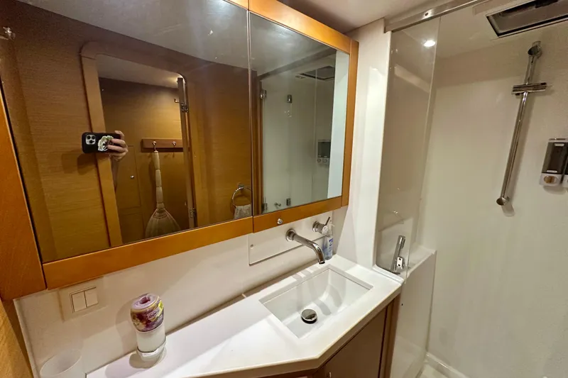 Slide: The Image of Bathroom interior of 2016 Lagoon 450 S yacht, featuring sink and shower area. - 82