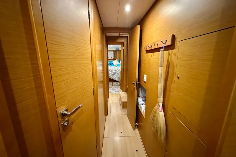 Slide: The Image of Interior hallway of 2016 Lagoon 450 S yacht with wooden finish and cozy bedroom view. - 83