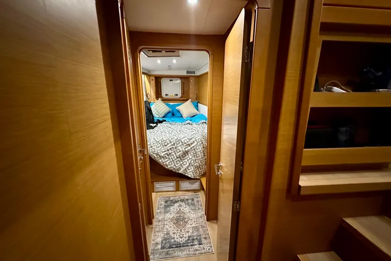 Slide: The Image of Interior cabin of 2016 Lagoon 450 S yacht with cozy bedding and wooden finish. - 84