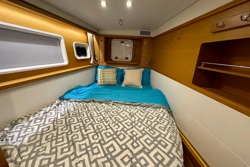Slide: The Image of Cozy cabin interior of 2016 Lagoon 450 S yacht with comfortable bedding. - 85