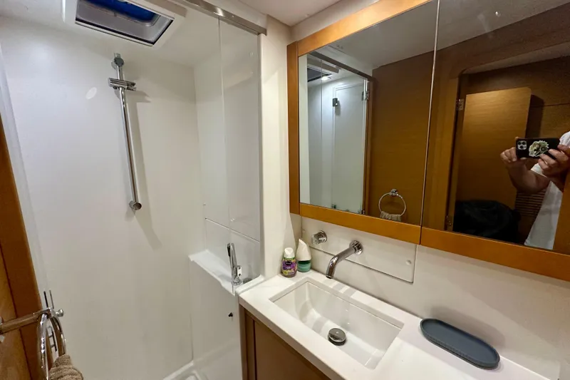 Slide: The Image of Bathroom interior of 2016 Lagoon 450 S yacht, featuring shower and sink area. - 87