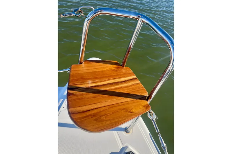 Slide: The Image of Teak wood step on Lagoon 450 S catamaran, 2016 model, with stainless steel railing. - 9