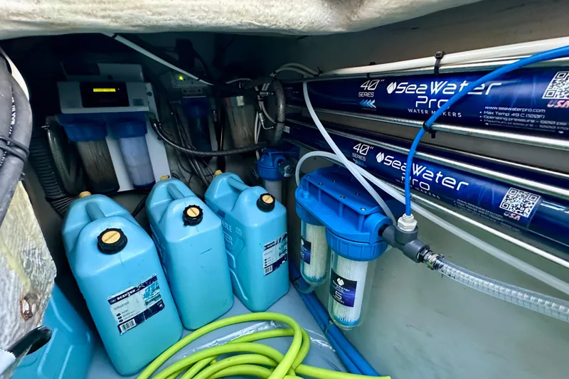 Slide: The Image of Water filtration system in a 2016 Lagoon 450 S yacht, featuring SeaWater Pro equipment. - 95