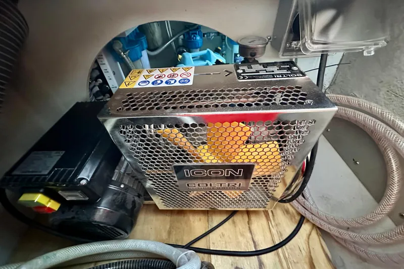 Slide: The Image of Engine compartment of a 2016 Lagoon 450 S yacht featuring an ICON Coltri compressor. - 97