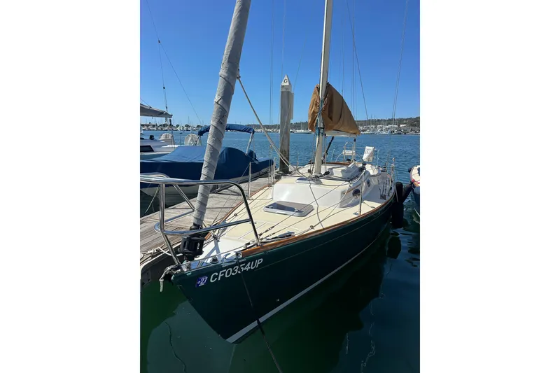 The Image of 2011 Alerion Sport 33 sailboat docked in a sunny marina. - 0