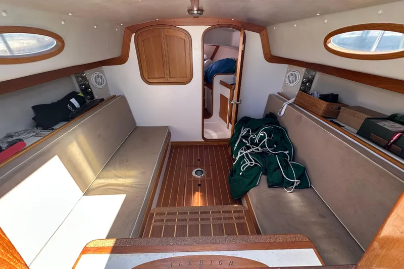 Slide: The Image of Interior of 2011 Alerion Sport 33 sailboat with wooden accents and seating. - 13
