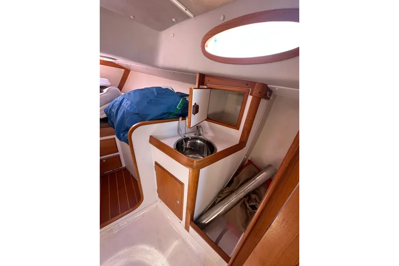 Slide: The Image of Interior of 2011 Alerion Sport 33 sailboat with compact sink and storage area. - 14