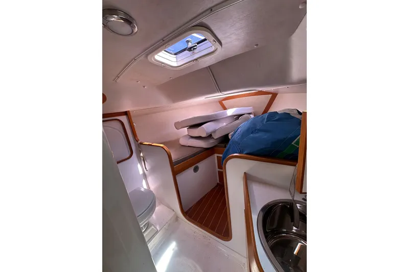 Slide: The Image of Interior cabin of 2011 Alerion Sport 33 sailboat with cushions and porthole. - 15