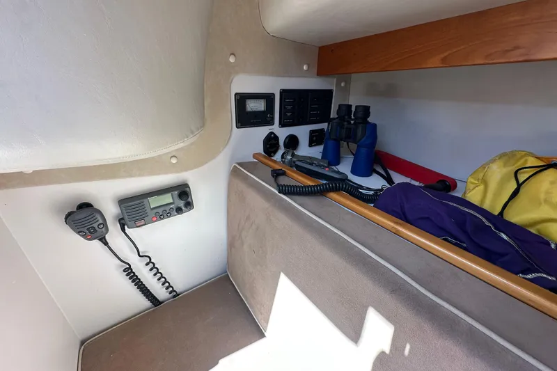 Slide: The Image of Interior of 2011 Alerion Sport 33 sailboat with communication equipment and binoculars. - 18