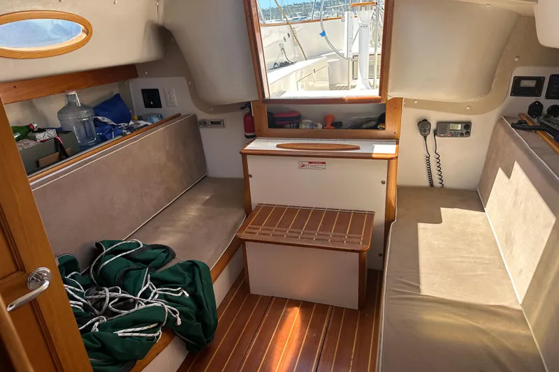 Slide: The Image of Interior of a 2011 Alerion Sport 33 sailboat with seating and nautical equipment. - 21
