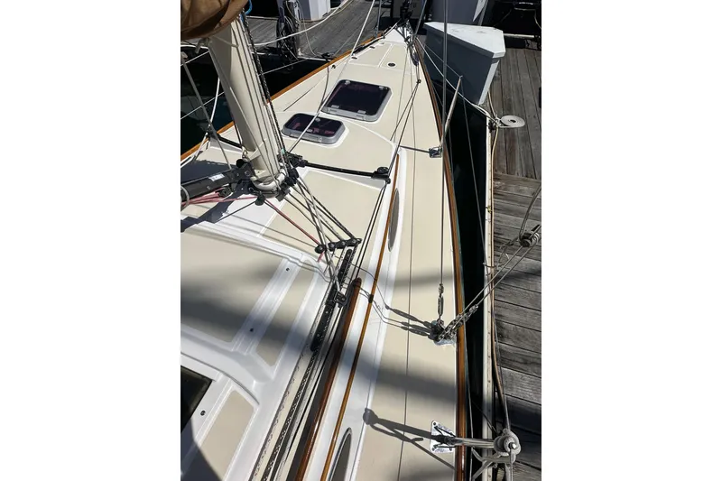 Slide: The Image of 2011 Alerion Sport 33 sailboat deck with rigging and dockside view. - 3