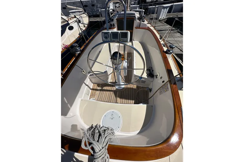 Slide: The Image of Cockpit view of 2011 Alerion Sport 33 sailboat with steering wheel and wooden trim. - 6