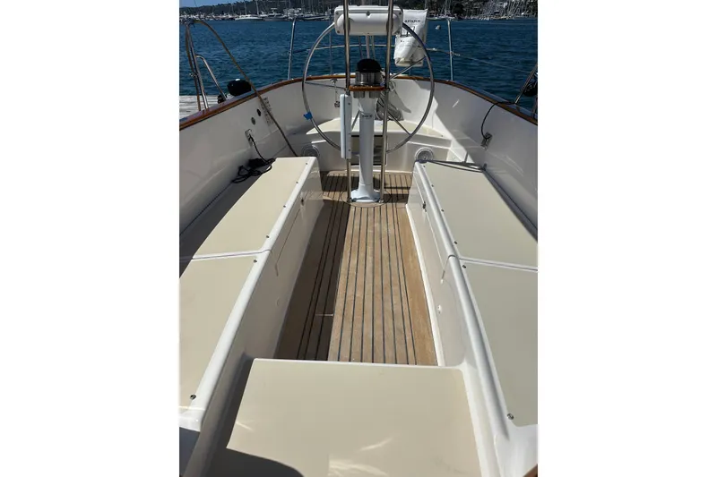 Slide: The Image of Cockpit of 2011 Alerion Sport 33 sailboat with wooden deck and seating. - 8