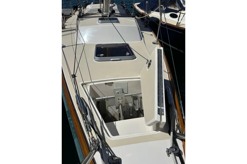 Slide: The Image of 2011 Alerion Sport 33 sailboat deck with open hatch and rigging details. - 9