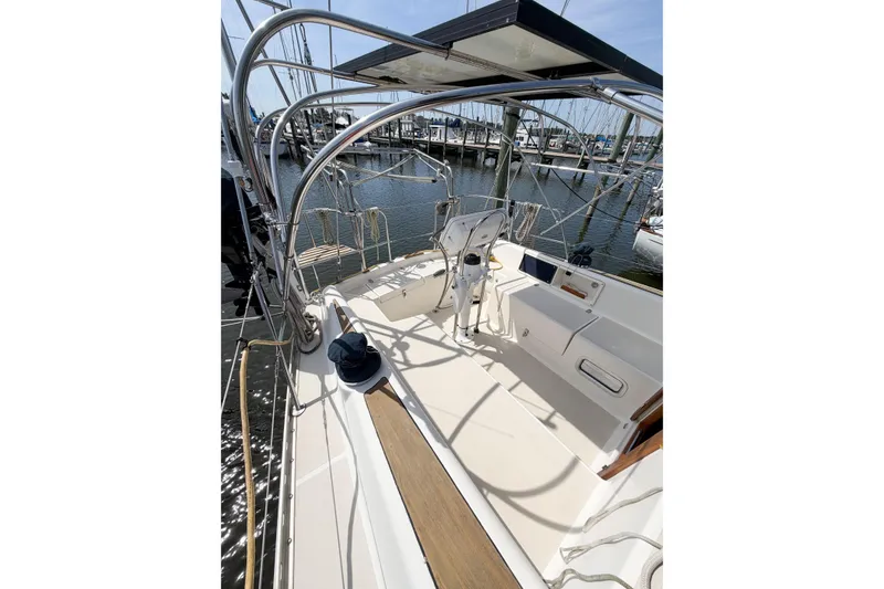 Slide: The Image of 2001 Caliber 40LRC sailboat cockpit with steering wheel, docked at marina. - 14