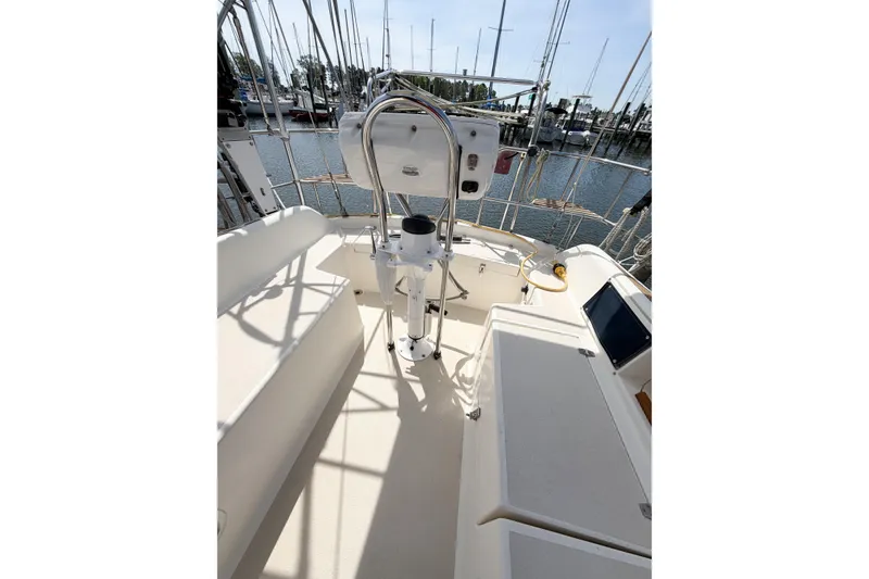 Slide: The Image of Cockpit view of a 2001 Caliber 40LRC sailboat docked at a marina. - 17