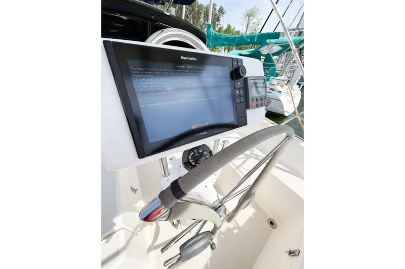 Slide: The Image of Steering wheel and navigation system on a 2001 Caliber 40LRC sailboat. - 19