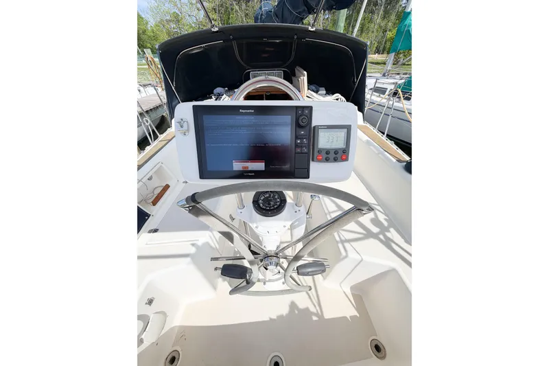 Slide: The Image of Cockpit of 2001 Caliber 40LRC sailboat with navigation equipment and steering wheel. - 20