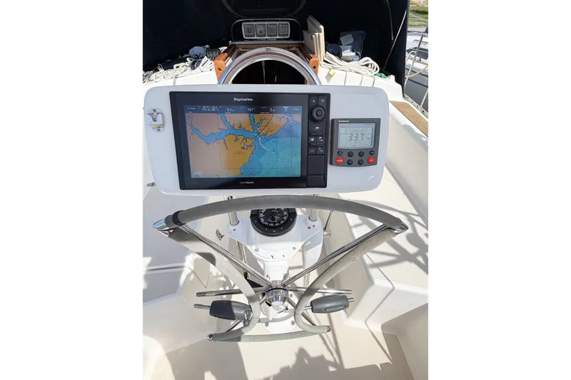 Slide: The Image of Steering wheel and navigation system on a 2001 Caliber 40LRC sailboat. - 21