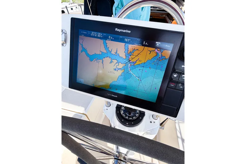 Slide: The Image of Raymarine navigation display on 2001 Caliber 40LRC sailboat, showing nautical chart and compass. - 22