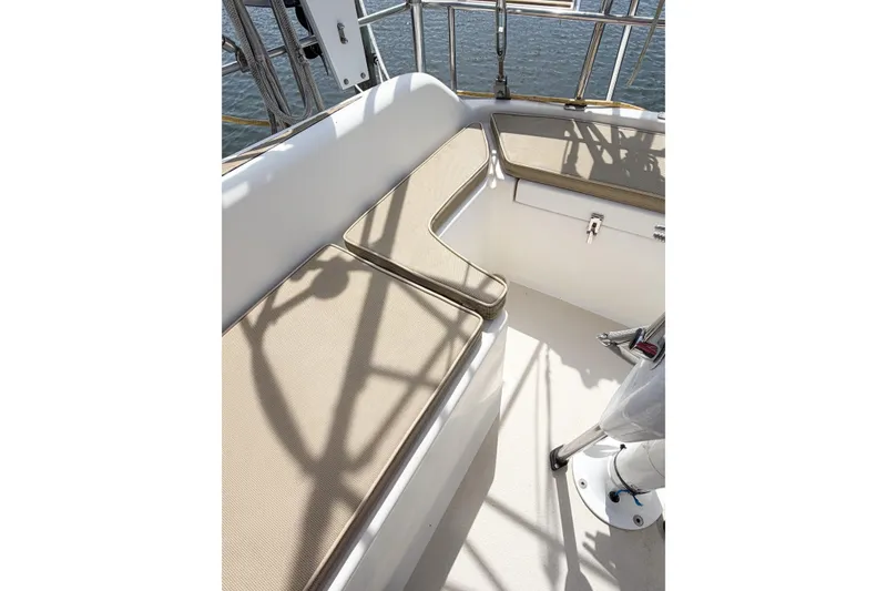 Slide: The Image of Interior view of a 2001 Caliber 40LRC sailboat cockpit with cushioned seating. - 24