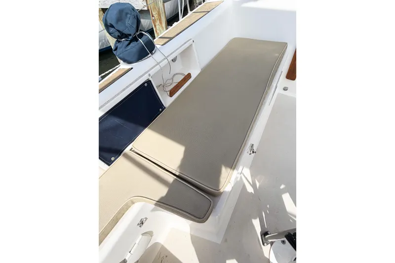 Slide: The Image of Interior view of a 2001 Caliber 40LRC sailboat with beige seating cushions. - 26