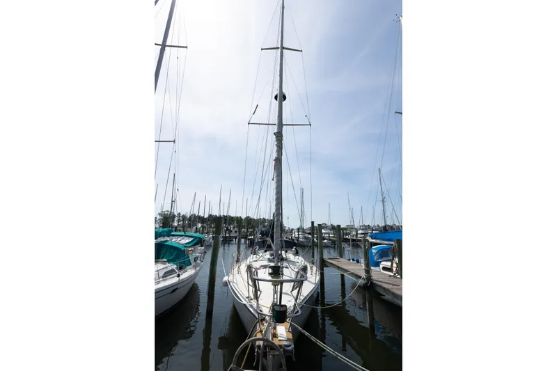 Slide: The Image of Sailboat docked in marina, Caliber 40LRC, 2001 model, under clear blue sky. - 3
