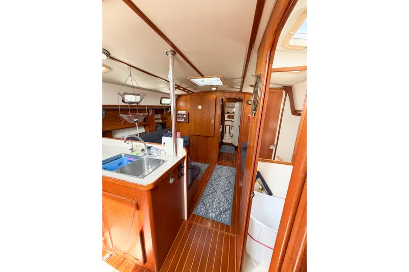 Slide: The Image of Interior of 2001 Caliber 40LRC yacht with wooden finishes and modern amenities. - 34