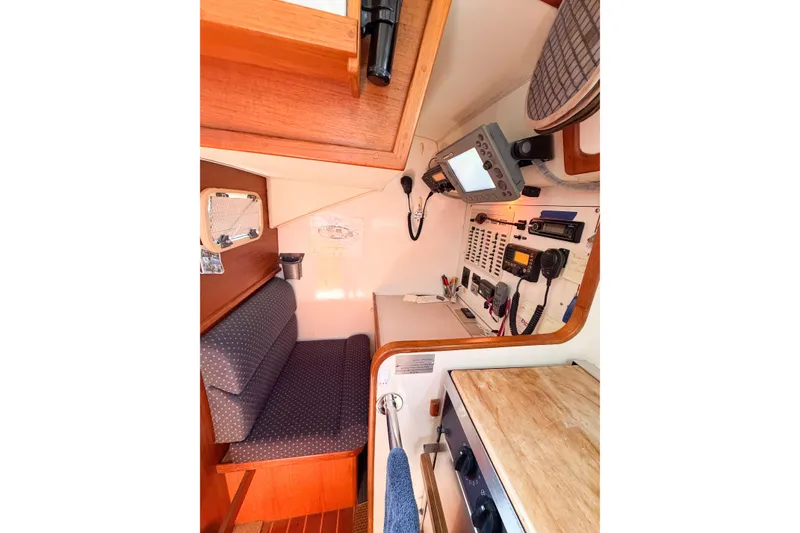 Slide: The Image of Interior of 2001 Caliber 40LRC sailboat with navigation equipment and seating area. - 37