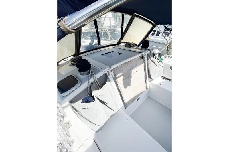 Slide: The Image of Cockpit of 2001 Caliber 40LRC sailboat with storage compartments and ropes. - 4