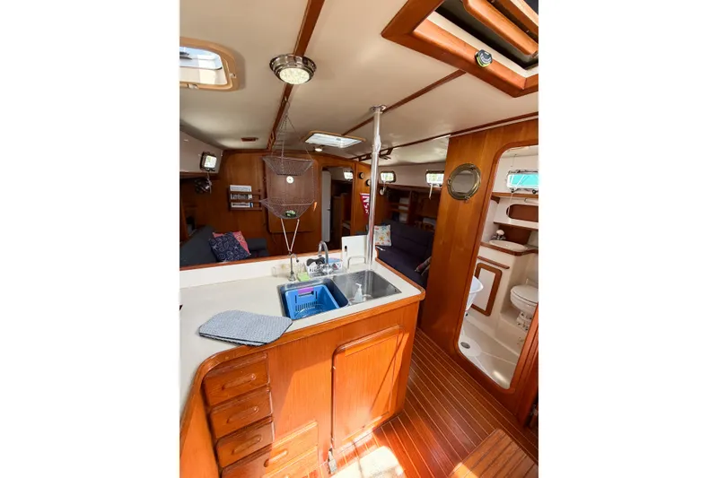 Slide: The Image of Interior of 2001 Caliber 40LRC sailboat with kitchen and living area. - 40