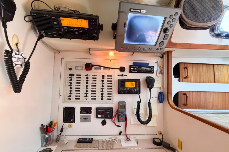 Slide: The Image of Control panel of a 2001 Caliber 40LRC yacht with navigation and communication equipment. - 66