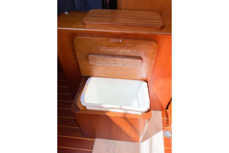 Slide: The Image of Wooden interior storage compartment on a 2001 Caliber 40LRC boat. - 68