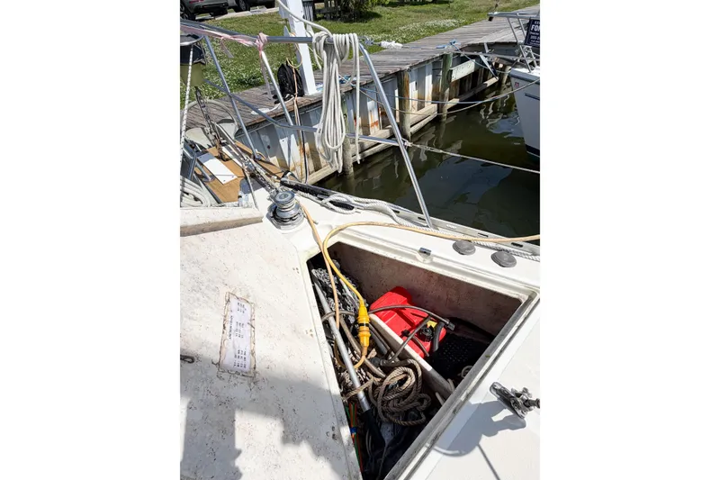 Slide: The Image of Open storage compartment on 2001 Caliber 40LRC sailboat docked at marina. - 74